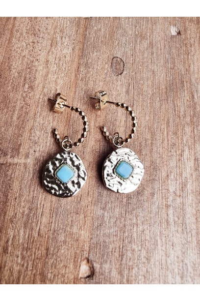 Pendientes de acero dorado...